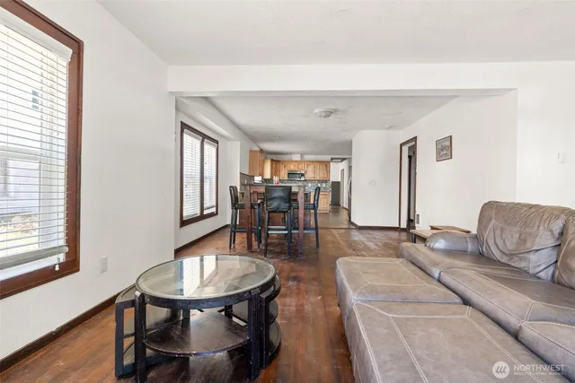 a kitchen with a table and chairs in it