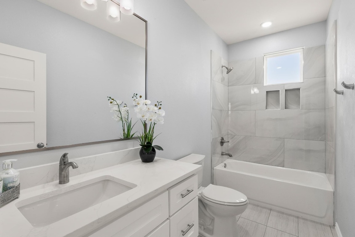 1136 County Road 484 Elgin, TX 78621 - Photo 26 of 37 Full bath with vanity, bathtub / shower combination, and tile patterned flooring