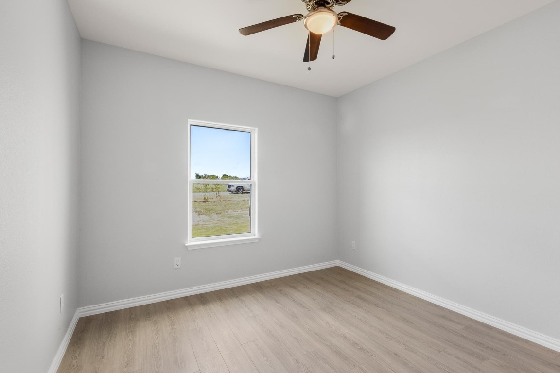1136 County Road 484 Elgin, TX 78621 - Photo 27 of 37 Spare room featuring light wood-type flooring and a ceiling fan