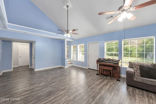 a view of livingroom with hardwood floor and ceiling fan