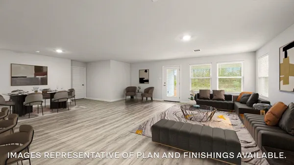 a living room with furniture a large window and a wooden floor