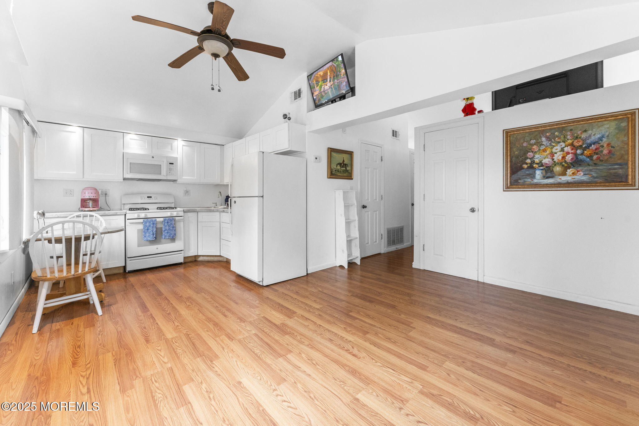 809 Beach Boulevard Forked River, NJ 08731 - Photo 2 of 16 a view of a kitchen with furniture and wooden floor