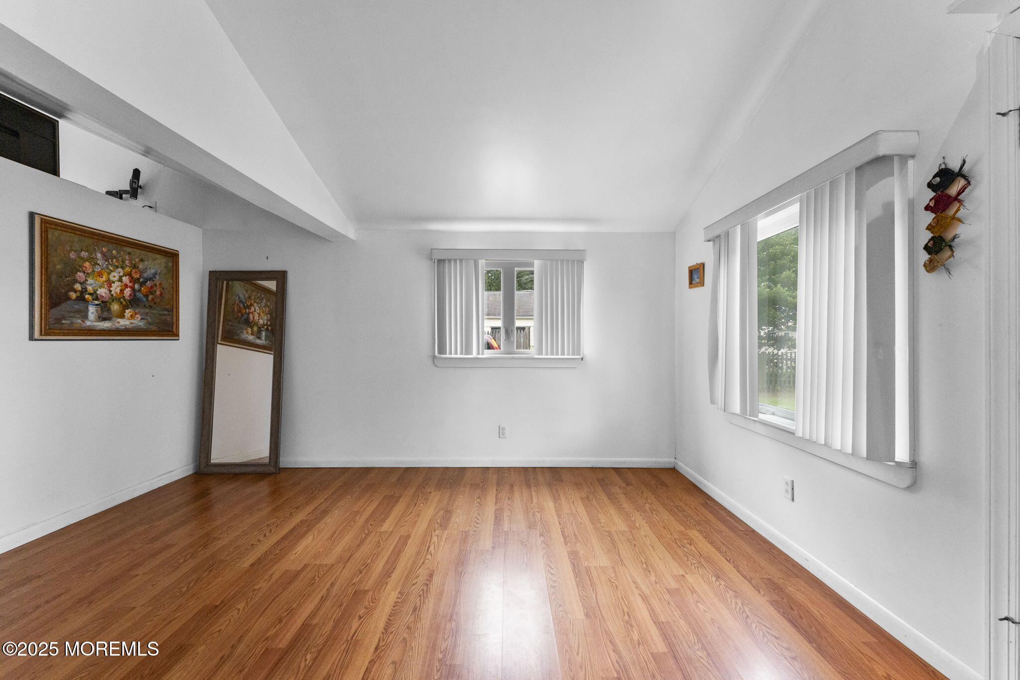 809 Beach Boulevard Forked River, NJ 08731 - Photo 4 of 16 a view of empty room with wooden floor and fan