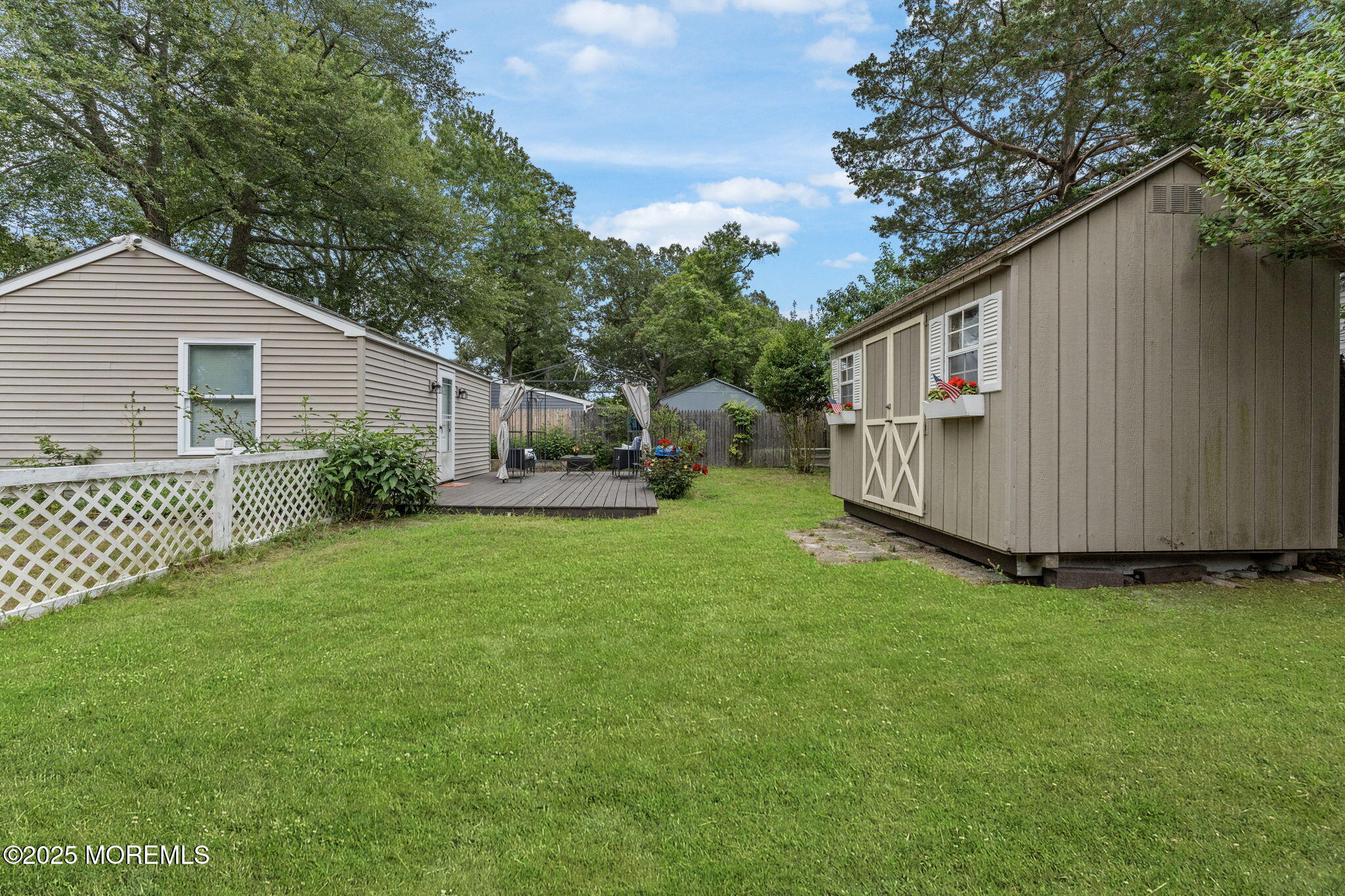 809 Beach Boulevard Forked River, NJ 08731 - Photo 6 of 16 a view of backyard with garden and deck