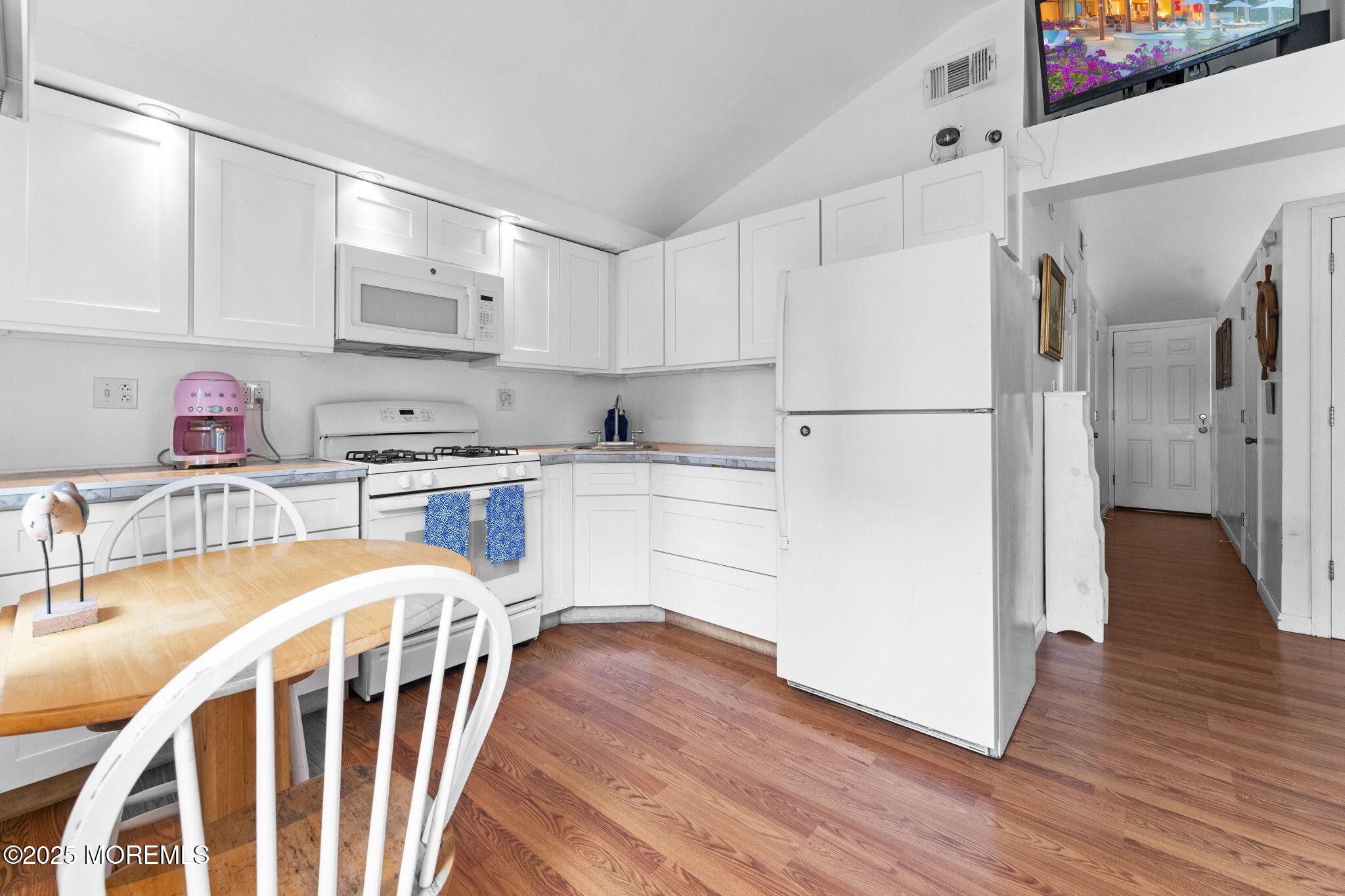 809 Beach Boulevard Forked River, NJ 08731 - Photo 7 of 16 a kitchen with stainless steel appliances a refrigerator sink and cabinets