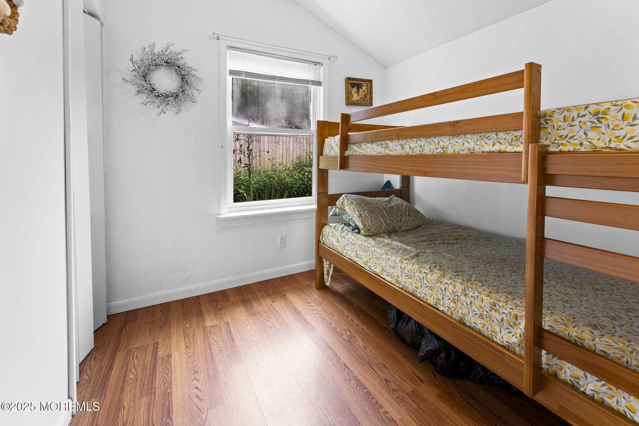 809 Beach Boulevard Forked River, NJ 08731 - Photo 9 of 16 a bedroom with a bed and a window