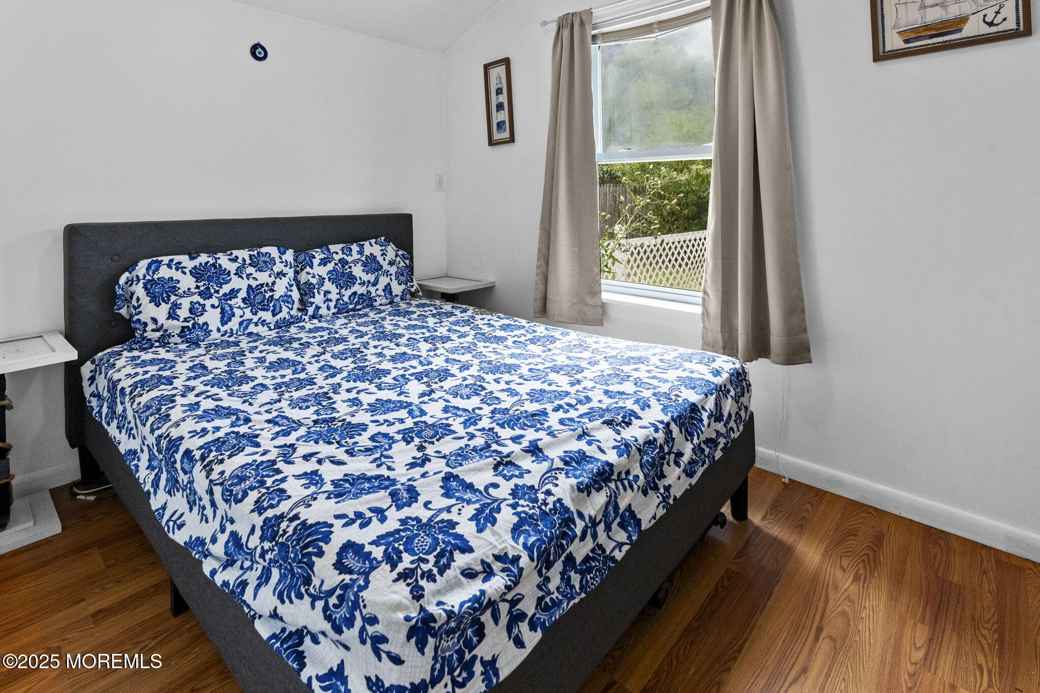 809 Beach Boulevard Forked River, NJ 08731 - Photo 10 of 16 a large bed sitting in a bedroom next to a window