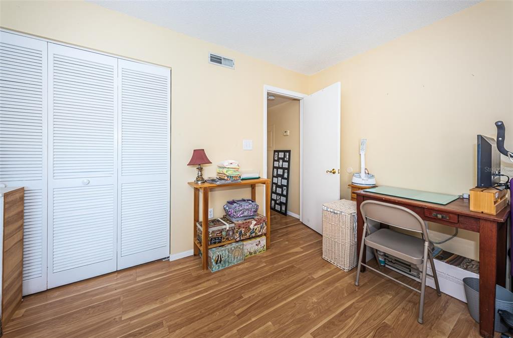 802 Lennox Road West, Unit 802 Palm Harbor, FL 34683 - Photo 18 of 42 a living room with furniture and a wooden floor