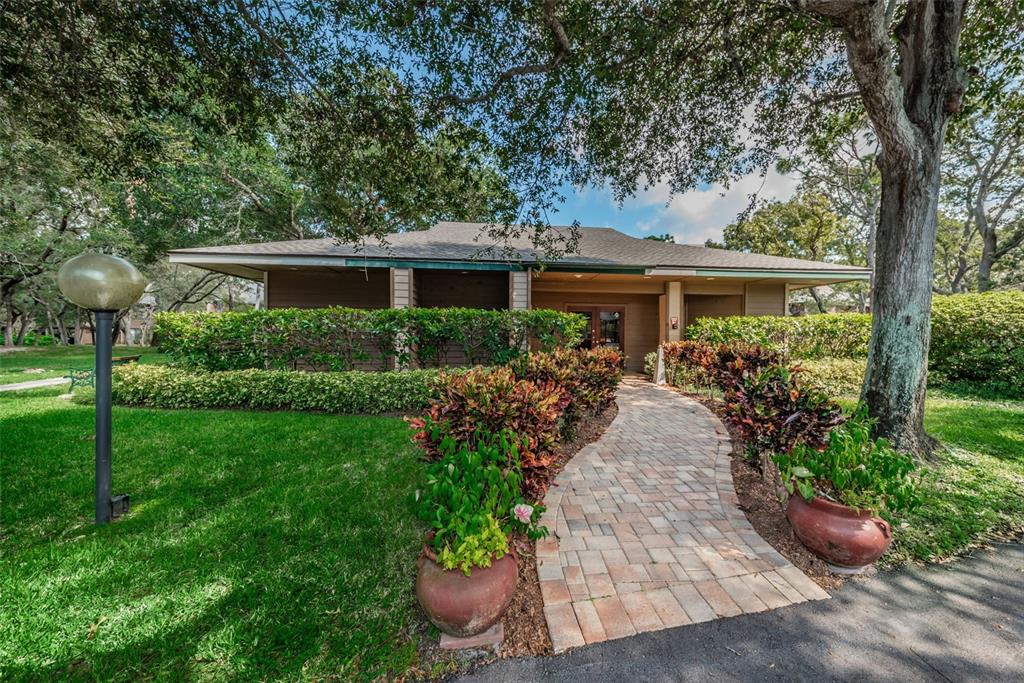 802 Lennox Road West, Unit 802 Palm Harbor, FL 34683 - Photo 28 of 42 a view of a house with garden