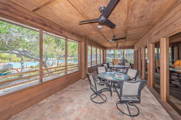 a view of a dining room with furniture window and outside view