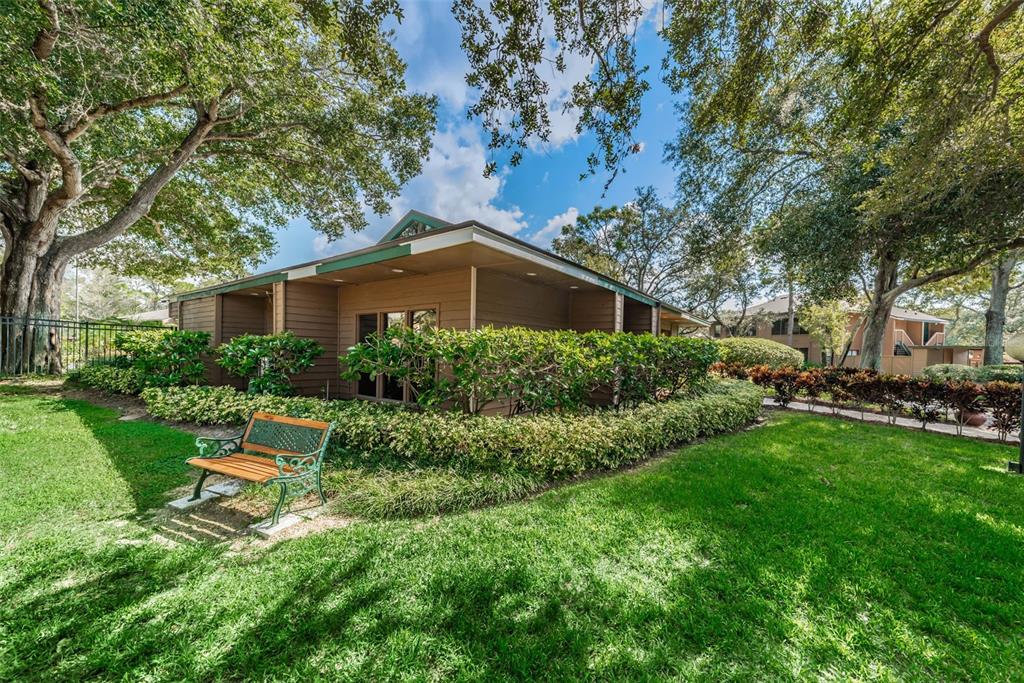 802 Lennox Road West, Unit 802 Palm Harbor, FL 34683 - Photo 41 of 42 a house view with a garden space