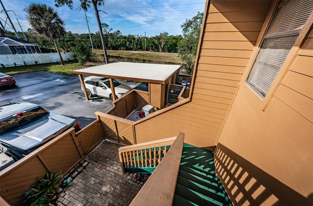 802 Lennox Road West, Unit 802 Palm Harbor, FL 34683 - Photo 5 of 42 a view of a patio with a table and chairs