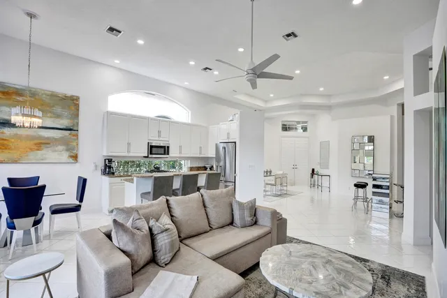 a bathroom with a double vanity sink toilet and shower