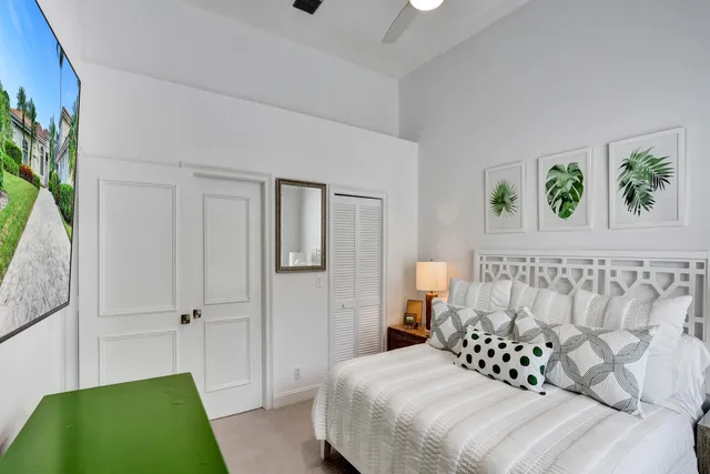 a view of a livingroom with furniture and a potted plant