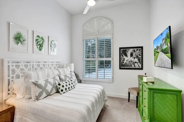 a backyard with table & chairs and a potted plant