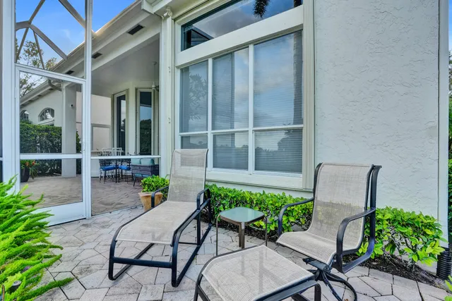 an aerial view of a house with garden space and ocean view