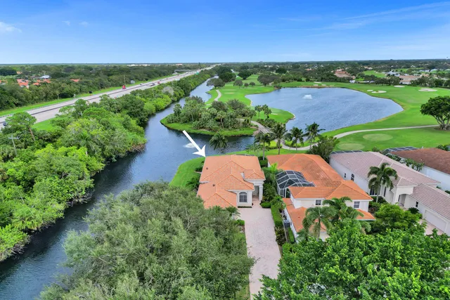 a view of a dining room with furniture wooden floor and chandelier