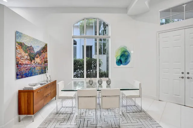 a living room with furniture a window and a table