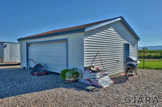 1404 Q Road Loma, CO 81524 - Photo 26 of 31 a front view of a house with a yard