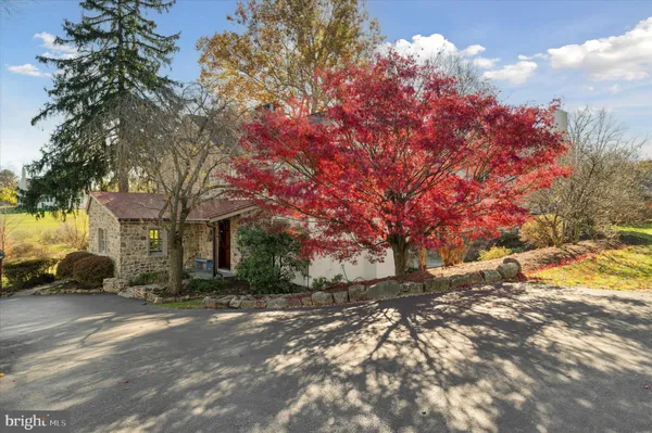 a kitchen with stainless steel appliances granite countertop a sink and stove