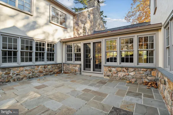 a kitchen with stainless steel appliances granite countertop a sink window and cabinets