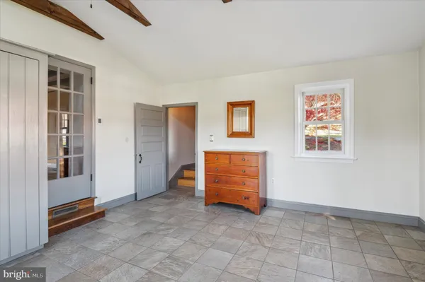 a view of an empty room with a window