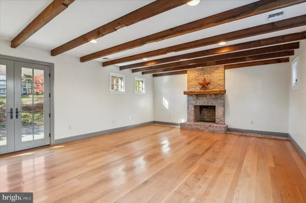 a bedroom with two beds and a window