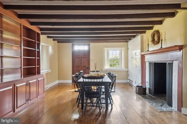 a bathroom with a shower a mirror and a sink