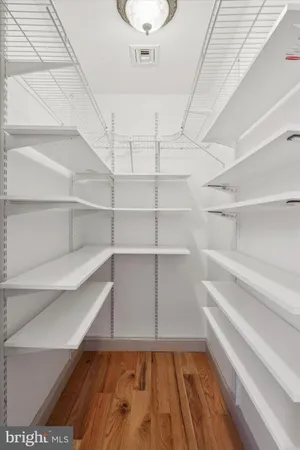 an aerial view of a house with swimming pool and yard