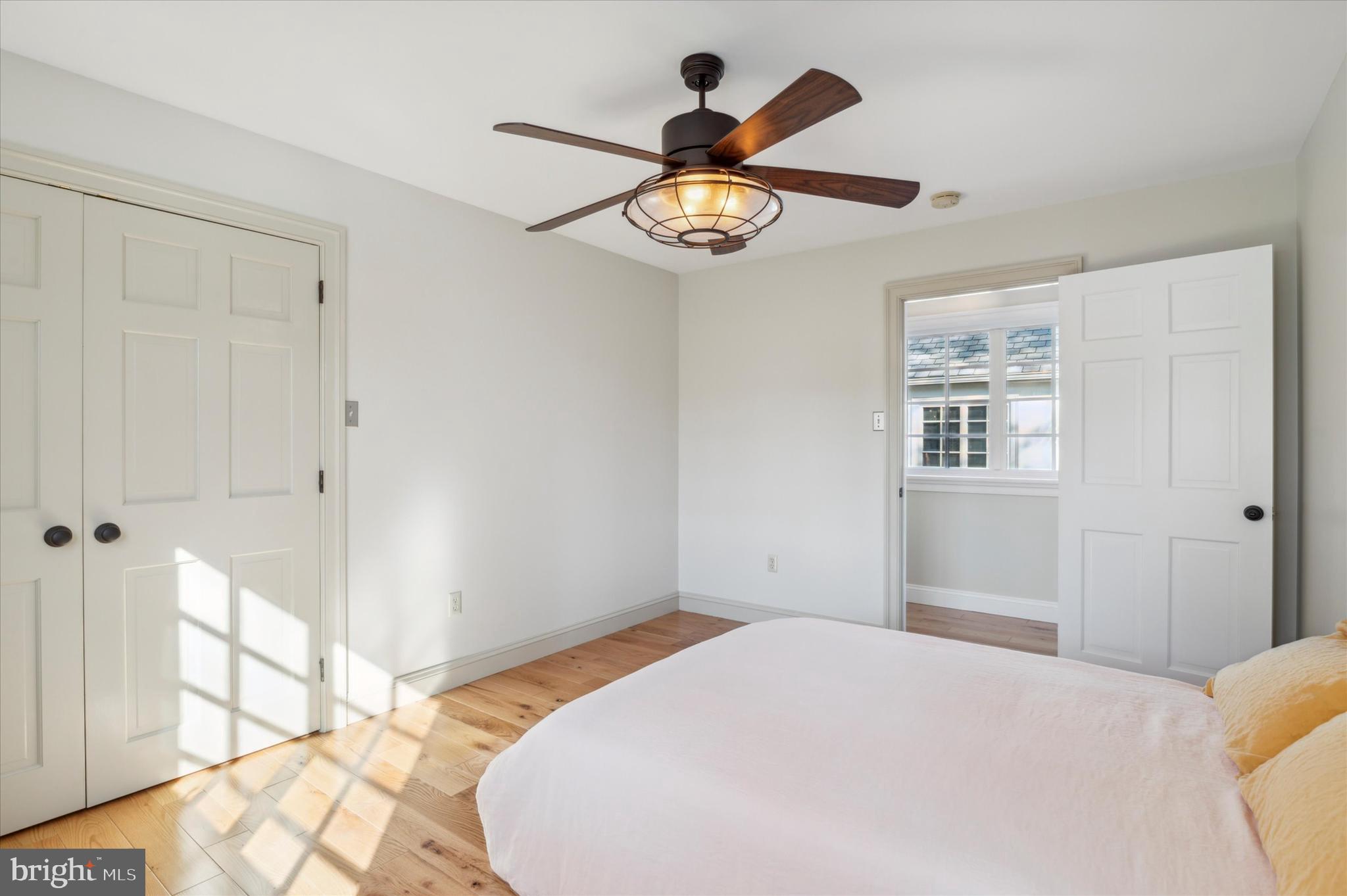 2 Fox Run Road Chester Springs, PA 19425 - Photo 50 of 103 a bedroom with a bed and a chandelier