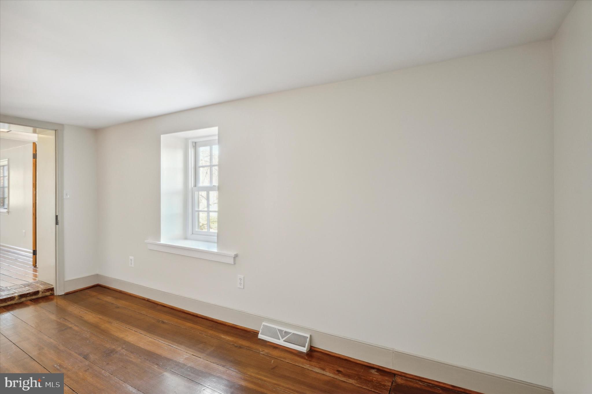 2 Fox Run Road Chester Springs, PA 19425 - Photo 54 of 103 an empty room with wooden floor and windows