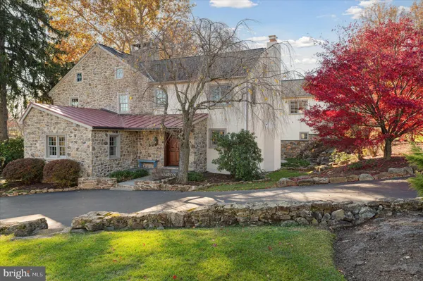 a view of a patio with table and chairs under an umbrella