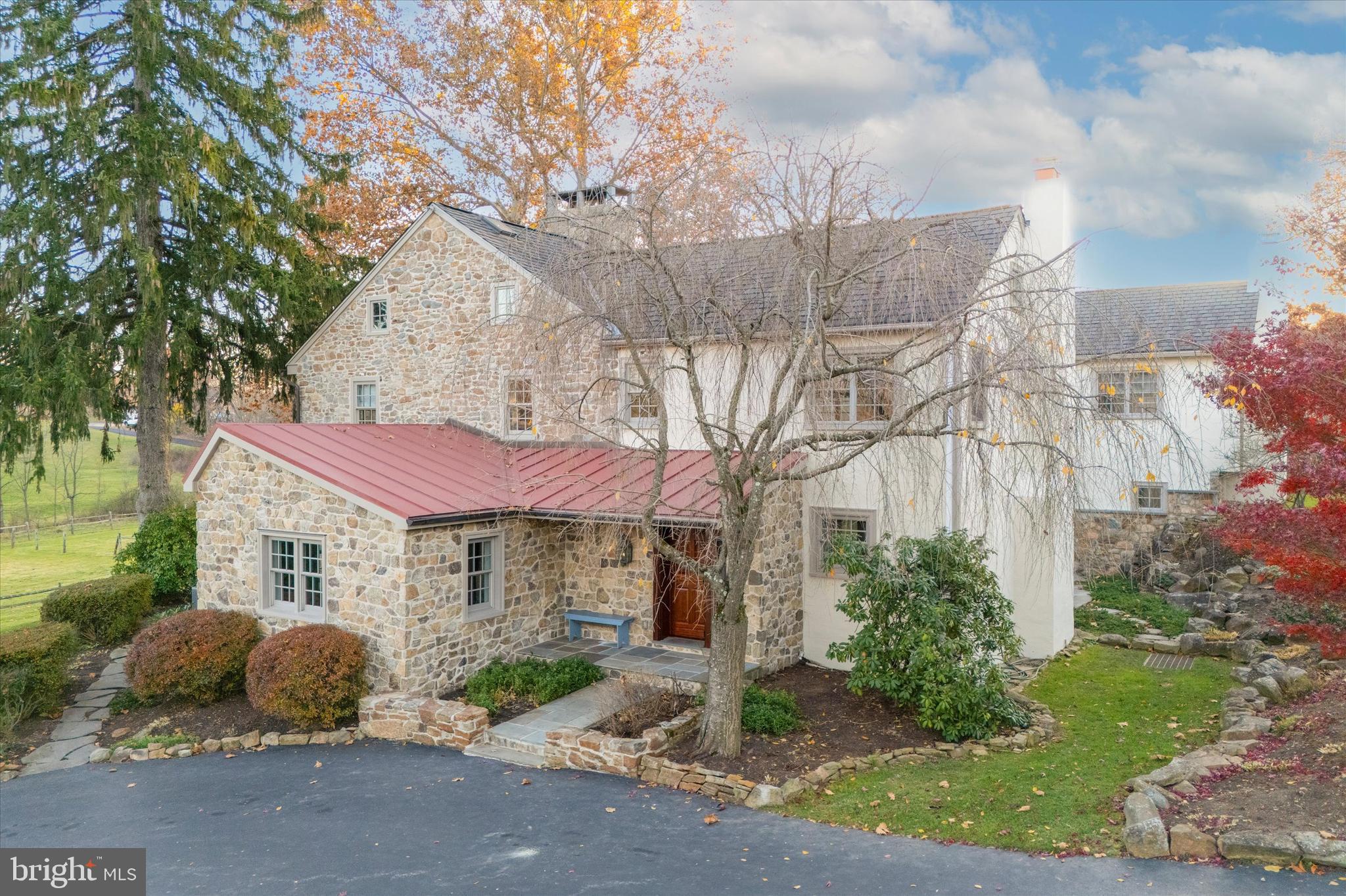 2 Fox Run Road Chester Springs, PA 19425 - Photo 83 of 103 a front view of a house with a yard and outdoor seating