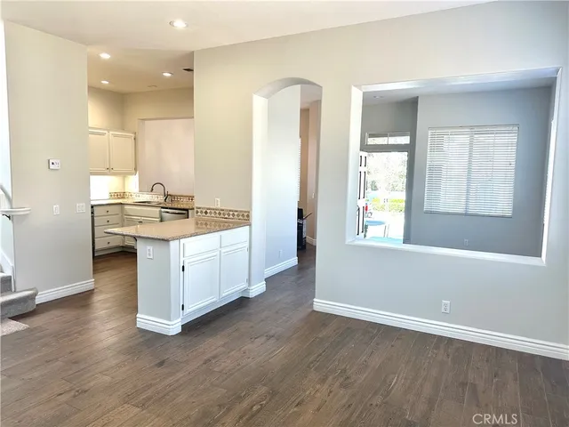 a view of a kitchen counter space and windows