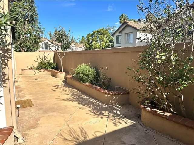 a view of a backyard of the house