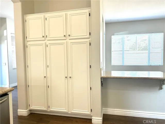 a view of cabinets and window