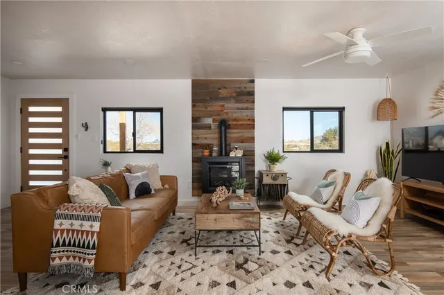 a living room with furniture rug and window
