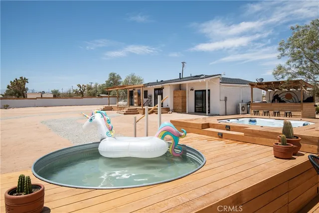 a view of a swimming pool with an outdoor seating