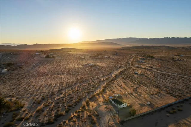 an aerial view of residential house and green space