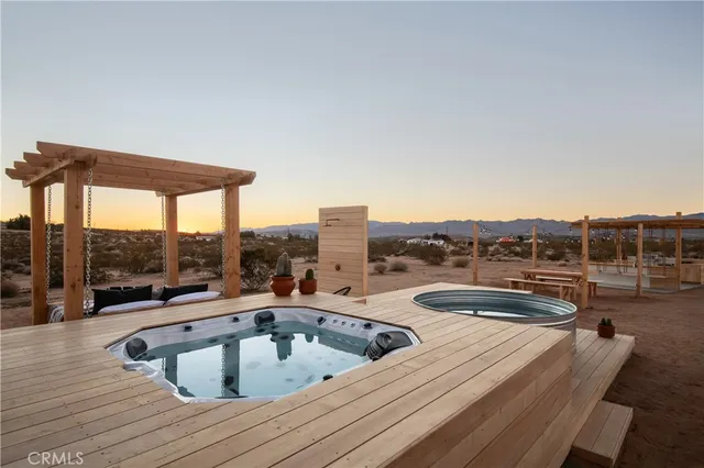 a view of roof deck with patio