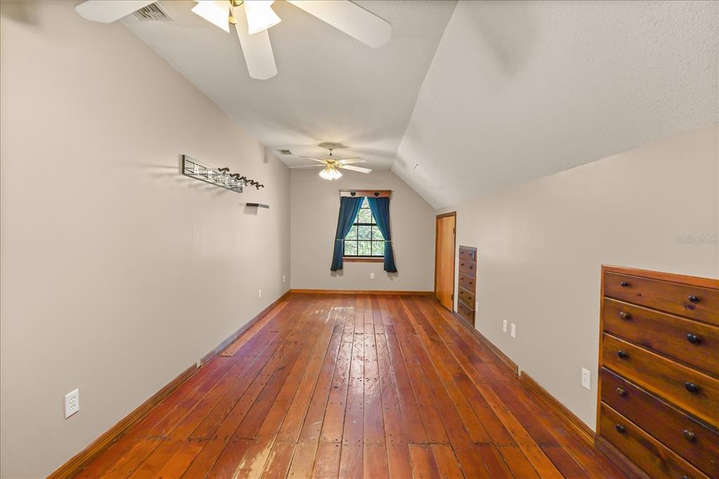 3303 Massee Road Davenport, FL 33837 - Photo 15 of 40 wooden floor in an empty room with a window