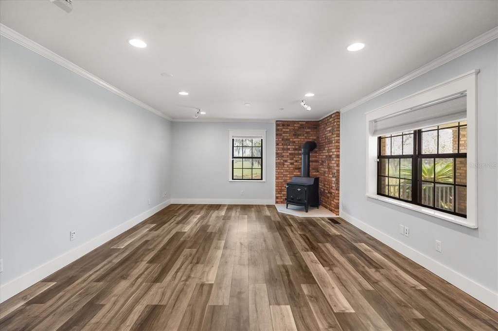 3303 Massee Road Davenport, FL 33837 - Photo 17 of 40 wooden floor in an empty room with a window