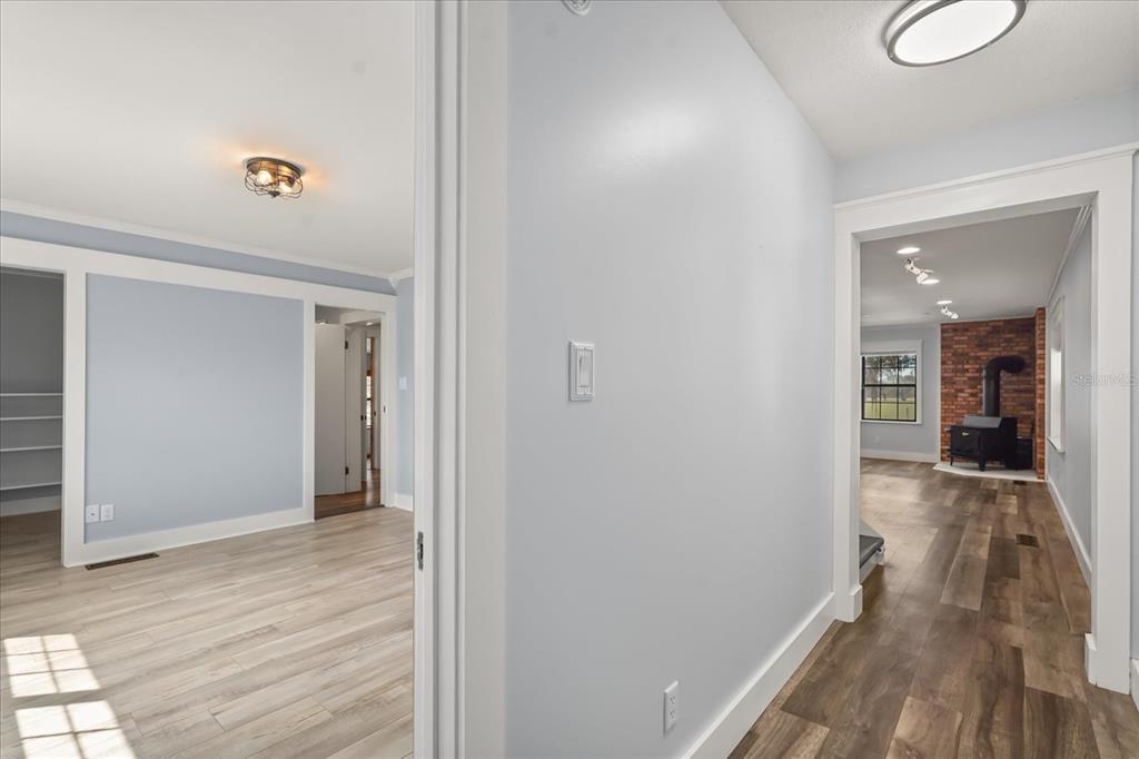 3303 Massee Road Davenport, FL 33837 - Photo 18 of 40 a view of a hallway view with wooden floor and staircase