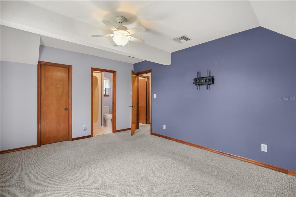 3303 Massee Road Davenport, FL 33837 - Photo 21 of 40 a view of an empty room with a ceiling fan