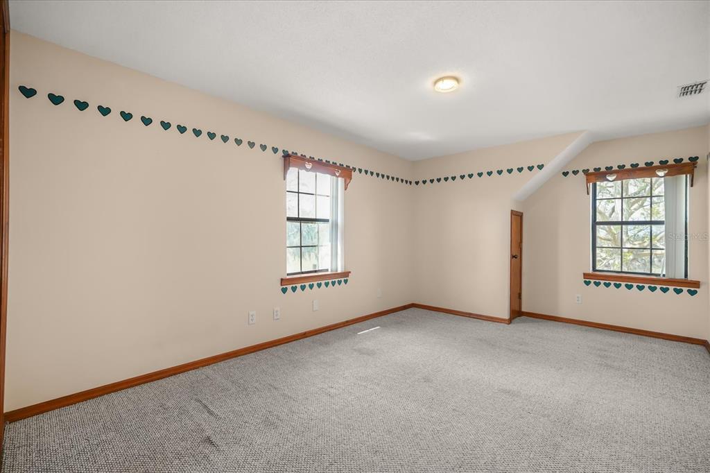 3303 Massee Road Davenport, FL 33837 - Photo 24 of 40 a view of an empty room with a window