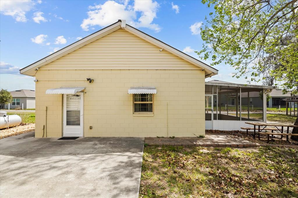 3303 Massee Road Davenport, FL 33837 - Photo 28 of 40 a view of a house with a yard