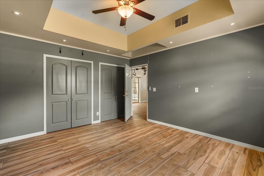 3303 Massee Road Davenport, FL 33837 - Photo 32 of 40 a view of an empty room with wooden floor
