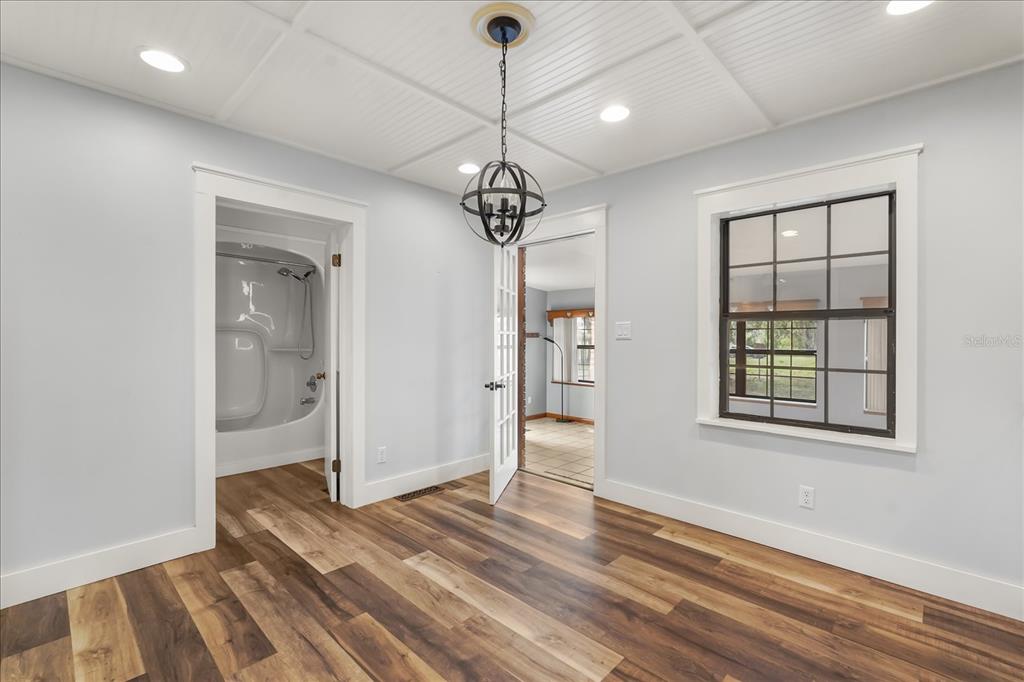 3303 Massee Road Davenport, FL 33837 - Photo 9 of 40 wooden floor in an empty room with a window
