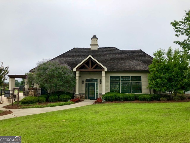 108 Gardens Drive Forsyth, GA 31029 - Photo 5 of 7 a front view of a house with a garden