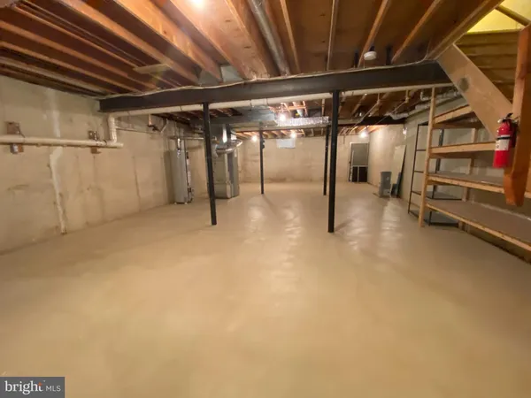 a view of an empty room with gym equipment
